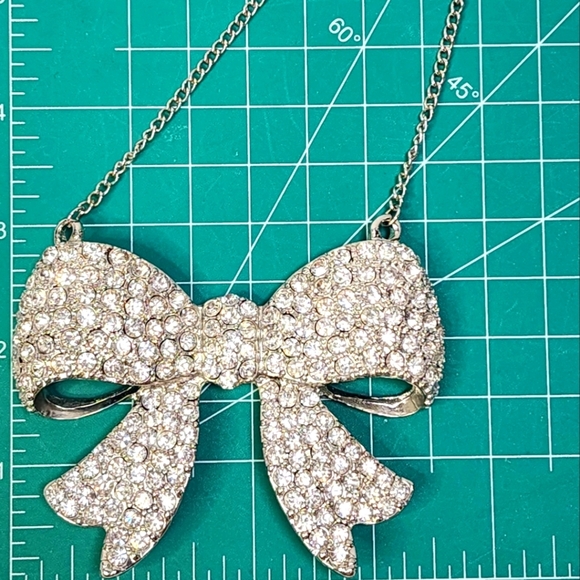 Fashion Forward Large Rhinestone and Silver Bow Pendant Necklace - Picture 6 of 11